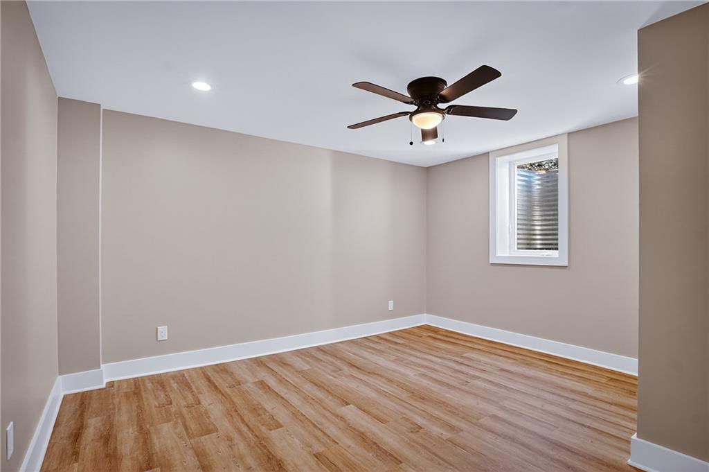 10390 Meinert Road Wexford, PA 15090 - Photo 30 of 42 a view of a big room with wooden floor a ceiling fan and closet