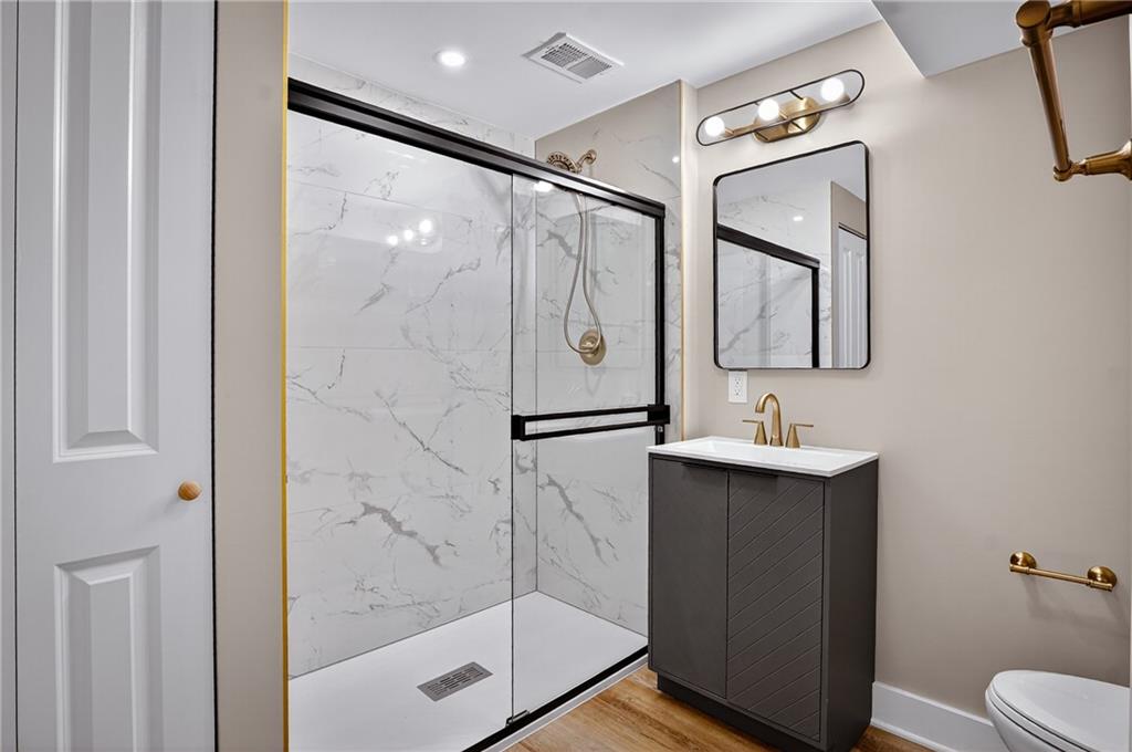 10390 Meinert Road Wexford, PA 15090 - Photo 32 of 42 a bathroom with a shower a mirror and a sink