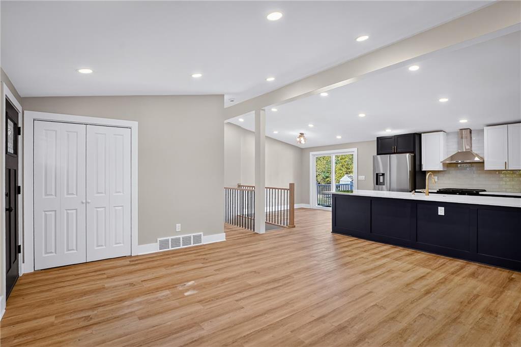 10390 Meinert Road Wexford, PA 15090 - Photo 4 of 42 a large kitchen with stainless steel appliances granite countertop a large counter top and wooden floors