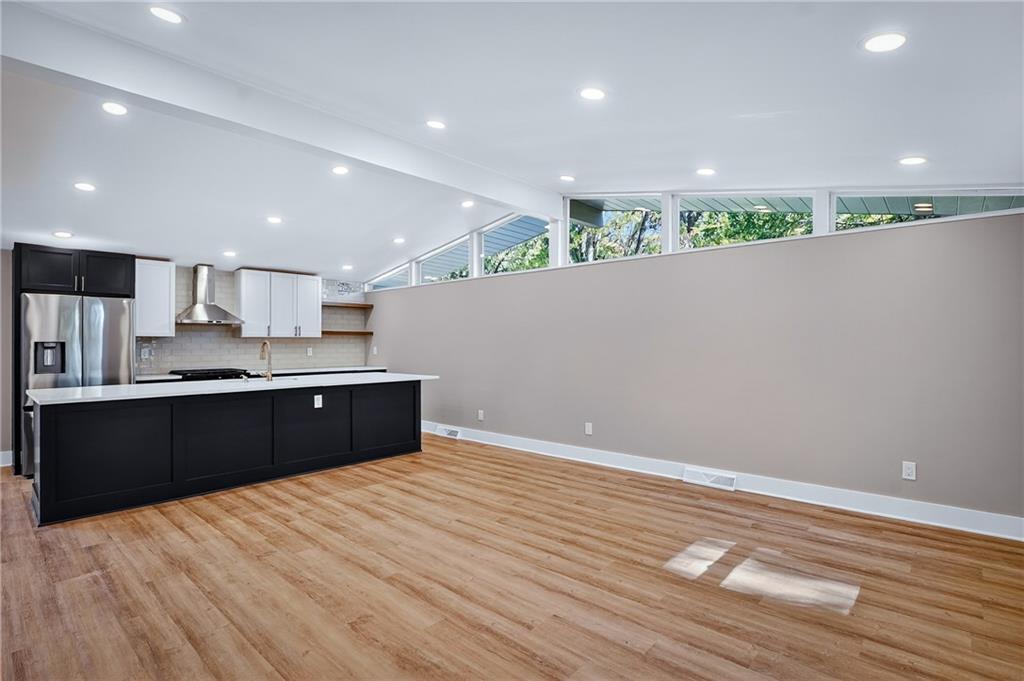 10390 Meinert Road Wexford, PA 15090 - Photo 5 of 42 a large kitchen with stainless steel appliances a large counter top and a wooden floors