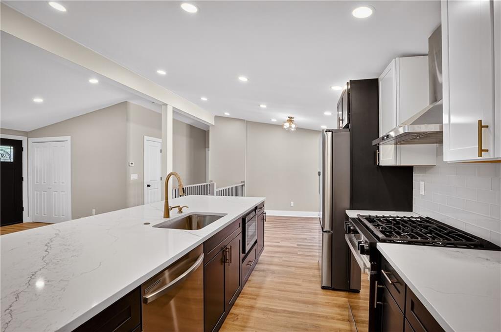 10390 Meinert Road Wexford, PA 15090 - Photo 8 of 42 a kitchen with stainless steel appliances a sink stove and refrigerator