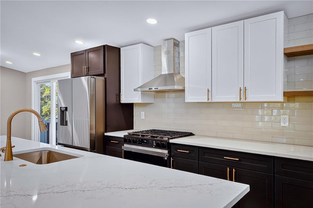 10390 Meinert Road Wexford, PA 15090 - Photo 9 of 42 a kitchen with stainless steel appliances granite countertop a refrigerator a sink and white cabinets