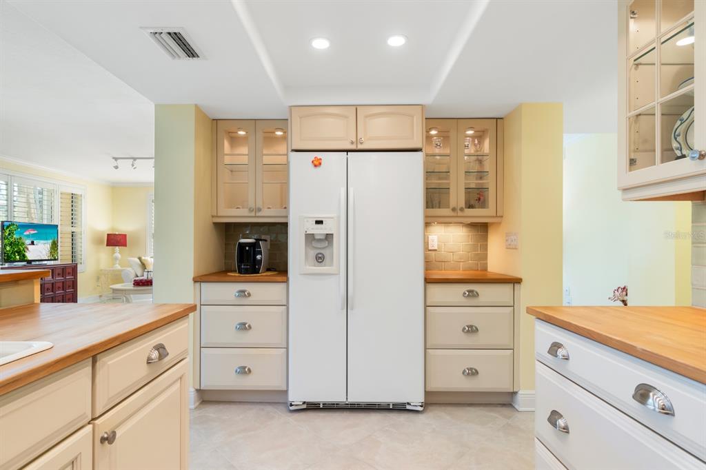 8767 Midnight Pass Road, Unit 101F Sarasota, FL 34242 - Photo 12 of 63 a kitchen with cabinets stainless steel appliances and window