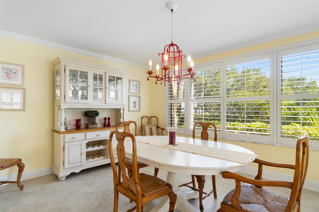 8767 Midnight Pass Road, Unit 101F Sarasota, FL 34242 - Photo 13 of 63 a view of a dining room with furniture window and outside view