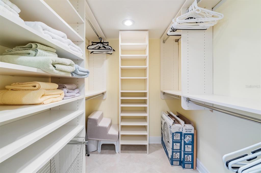 8767 Midnight Pass Road, Unit 101F Sarasota, FL 34242 - Photo 30 of 63 a view of walk in closet with empty racks