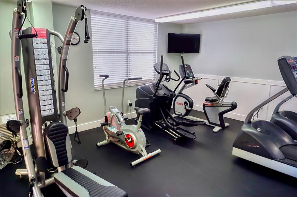 8767 Midnight Pass Road, Unit 101F Sarasota, FL 34242 - Photo 43 of 63 a view of a room with gym equipment