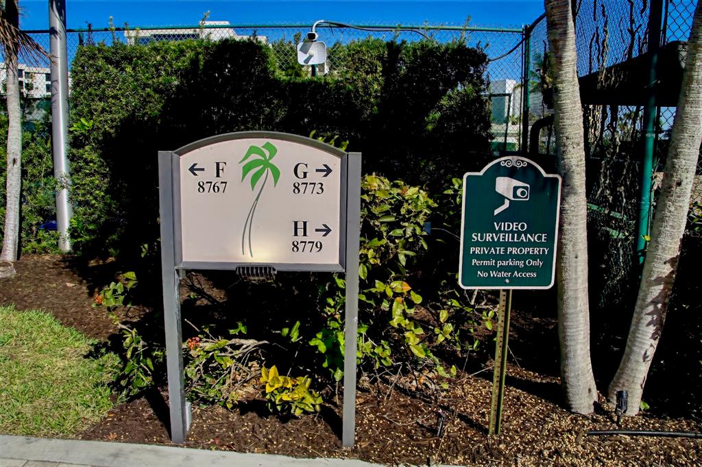 8767 Midnight Pass Road, Unit 101F Sarasota, FL 34242 - Photo 45 of 63 a sign on the side of the road
