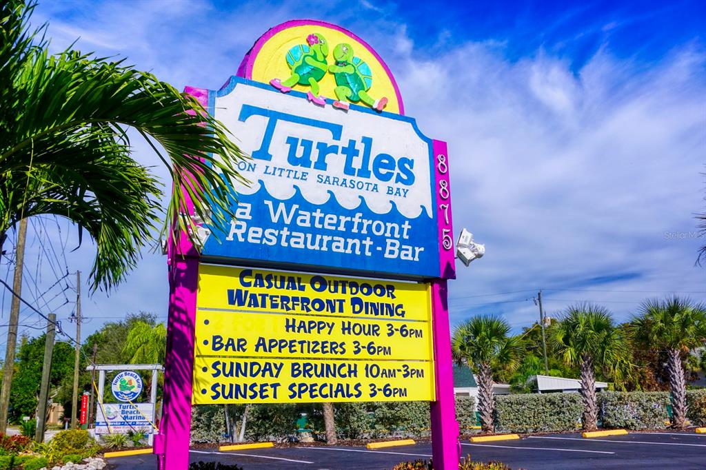 8767 Midnight Pass Road, Unit 101F Sarasota, FL 34242 - Photo 61 of 63 a sign on the street
