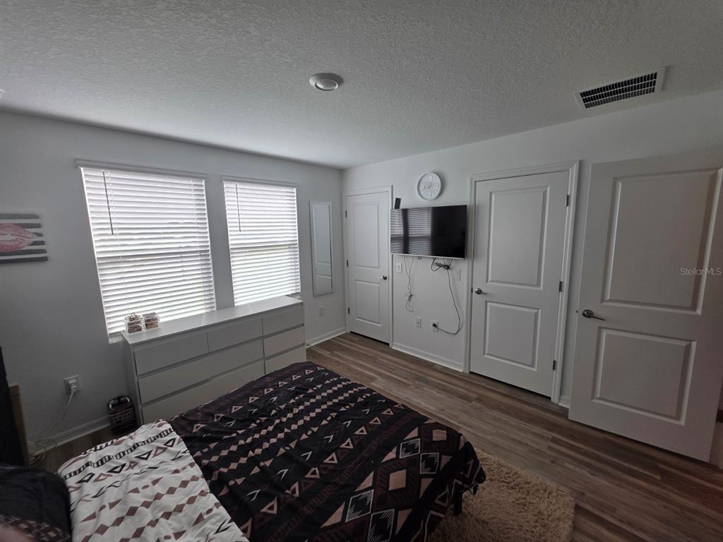 3318 Composition Street Kissimmee, FL 34758 - Photo 15 of 28 a bedroom with a bed and a window