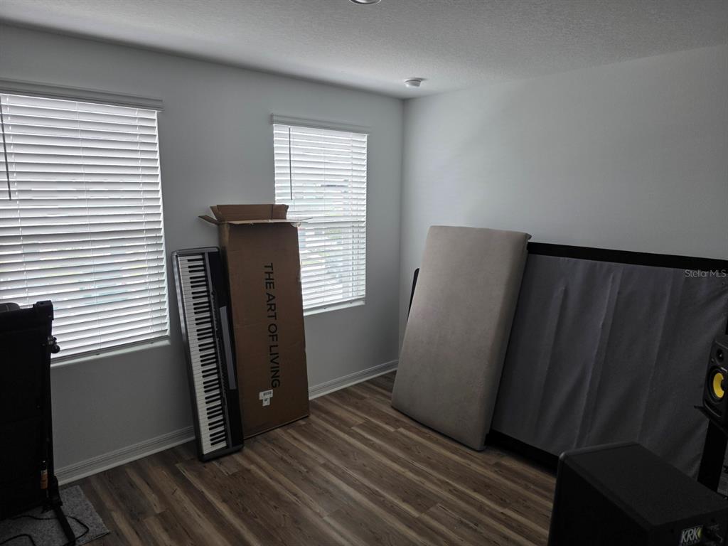 3318 Composition Street Kissimmee, FL 34758 - Photo 18 of 28 a view of a bathroom with wooden floor and a window