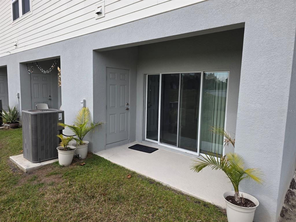 3318 Composition Street Kissimmee, FL 34758 - Photo 21 of 28 a view of a house with potted plants