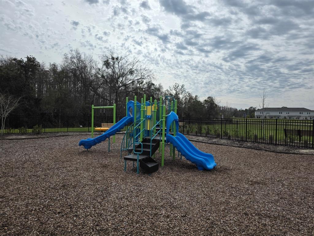 3318 Composition Street Kissimmee, FL 34758 - Photo 24 of 28 a view of a park with slide