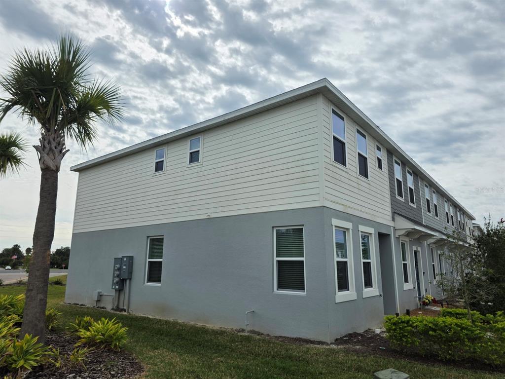 3318 Composition Street Kissimmee, FL 34758 - Photo 26 of 28 a front view of house with yard