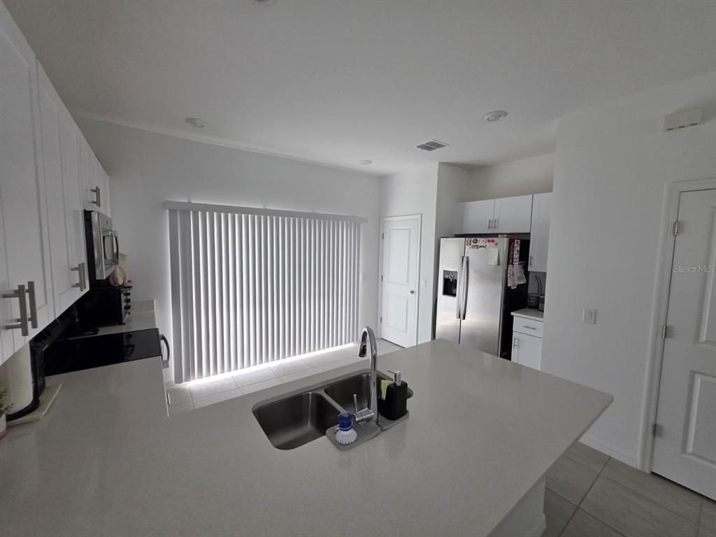 3318 Composition Street Kissimmee, FL 34758 - Photo 6 of 28 a view of a livingroom with a staircase