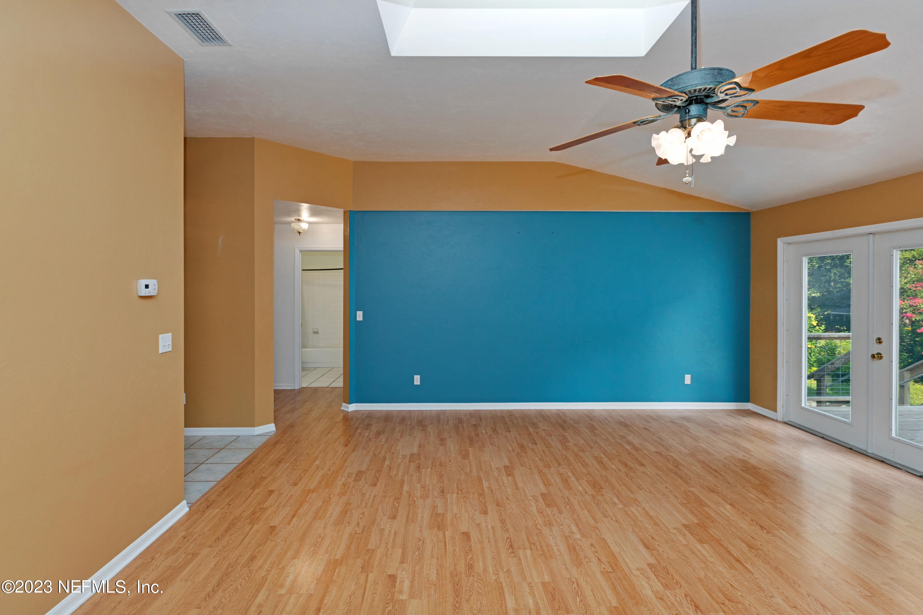 445 Southeast 28th Loop Melrose, FL 32666 - Photo 15 of 75 a view of an empty room with window and wooden floor