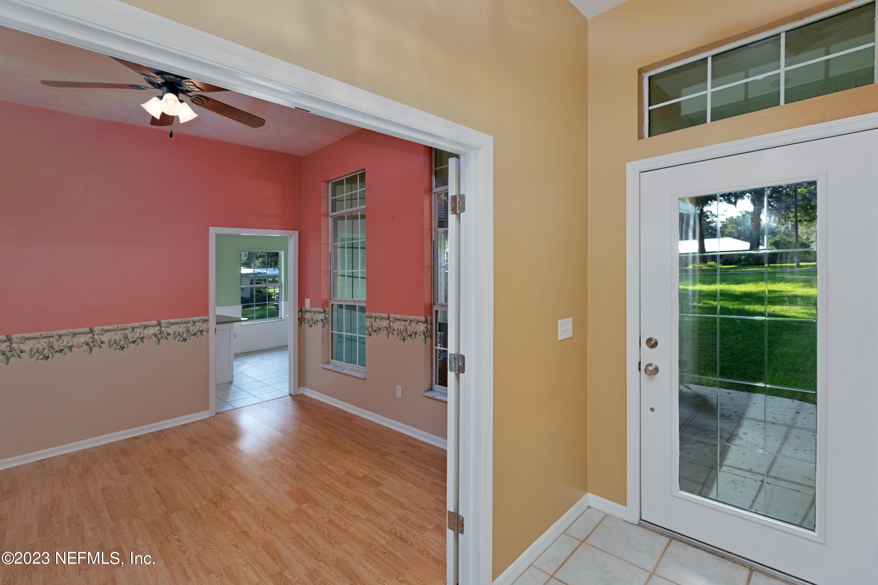 445 Southeast 28th Loop Melrose, FL 32666 - Photo 37 of 75 a view of a hallway with wooden floor and a living room