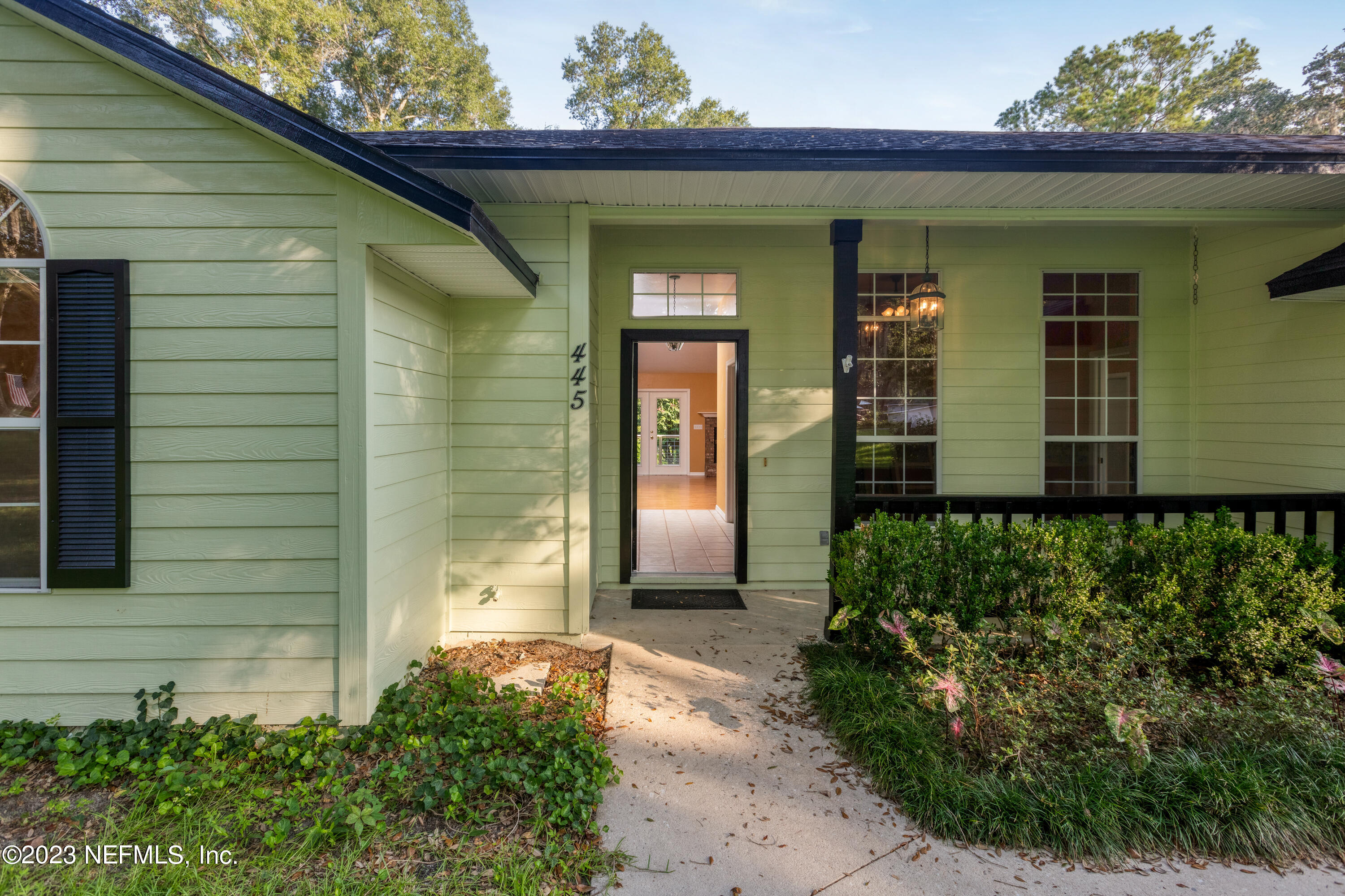 445 Southeast 28th Loop Melrose, FL 32666 - Photo 4 of 75 a front view of a house with garden