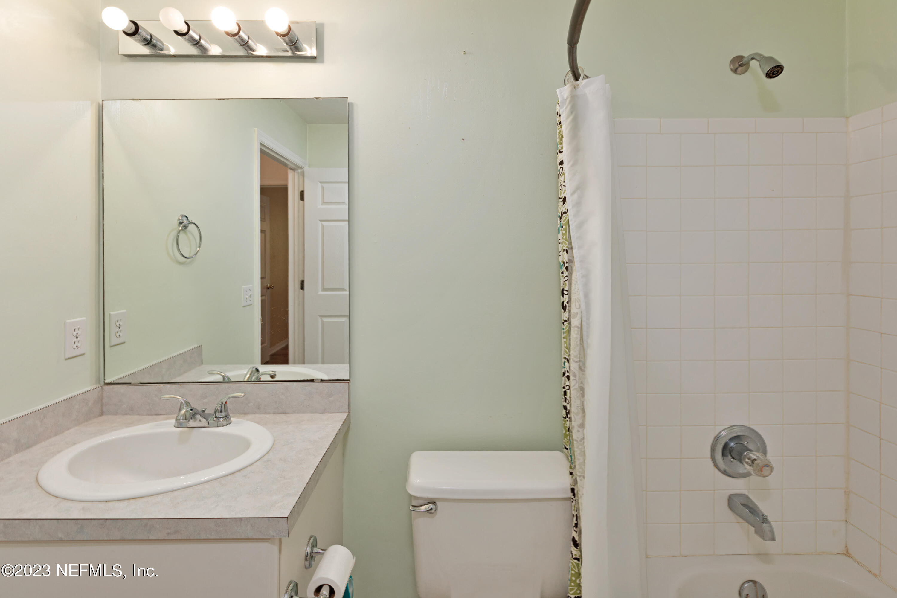 445 Southeast 28th Loop Melrose, FL 32666 - Photo 45 of 75 a bathroom with a sink a toilet and shower