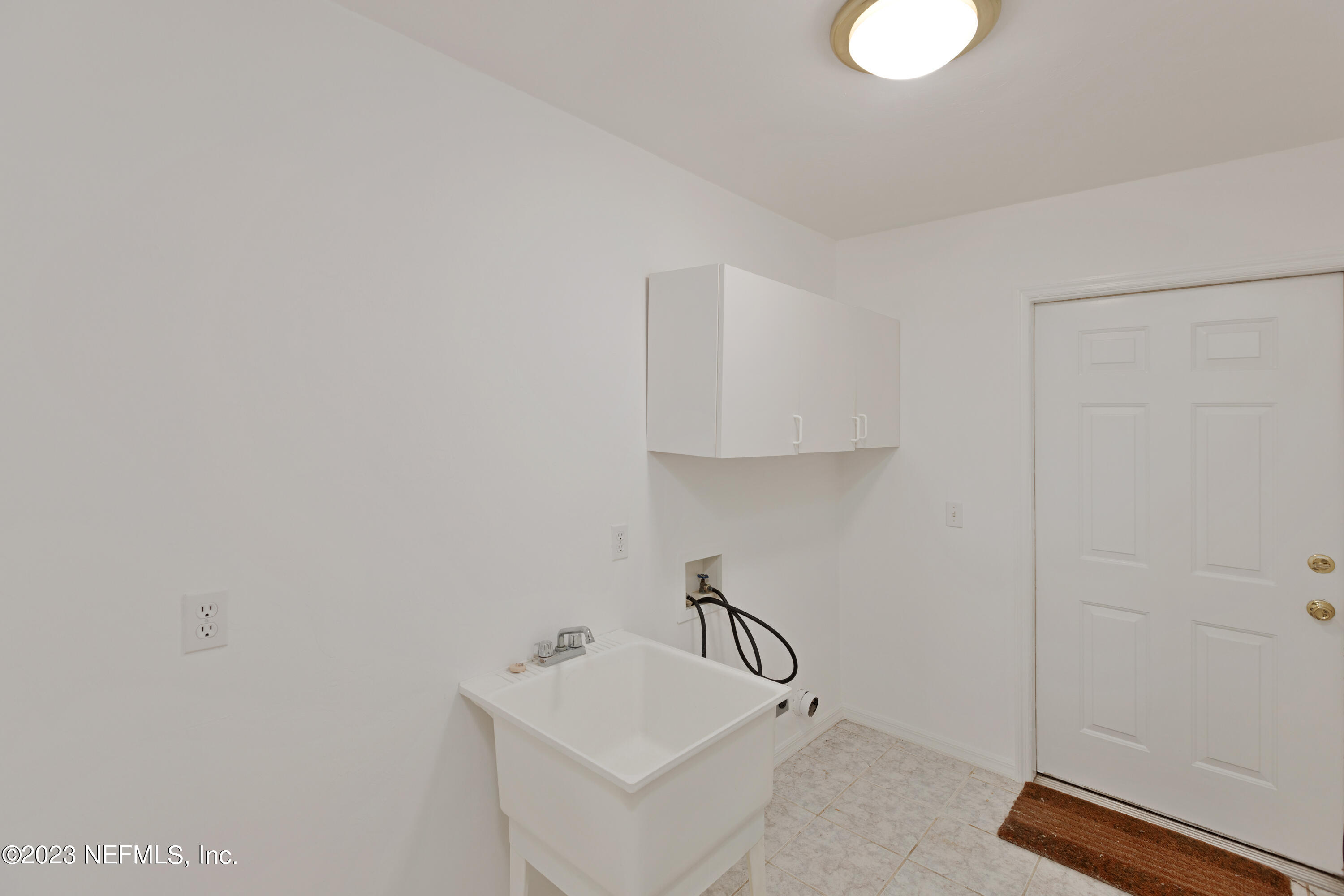 445 Southeast 28th Loop Melrose, FL 32666 - Photo 47 of 75 a bathroom with a sink and mirror