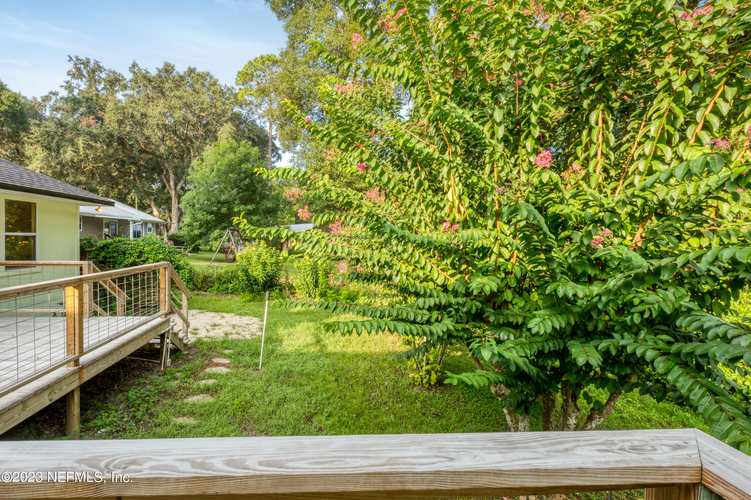 445 Southeast 28th Loop Melrose, FL 32666 - Photo 57 of 75 a backyard of a house with lots of green space