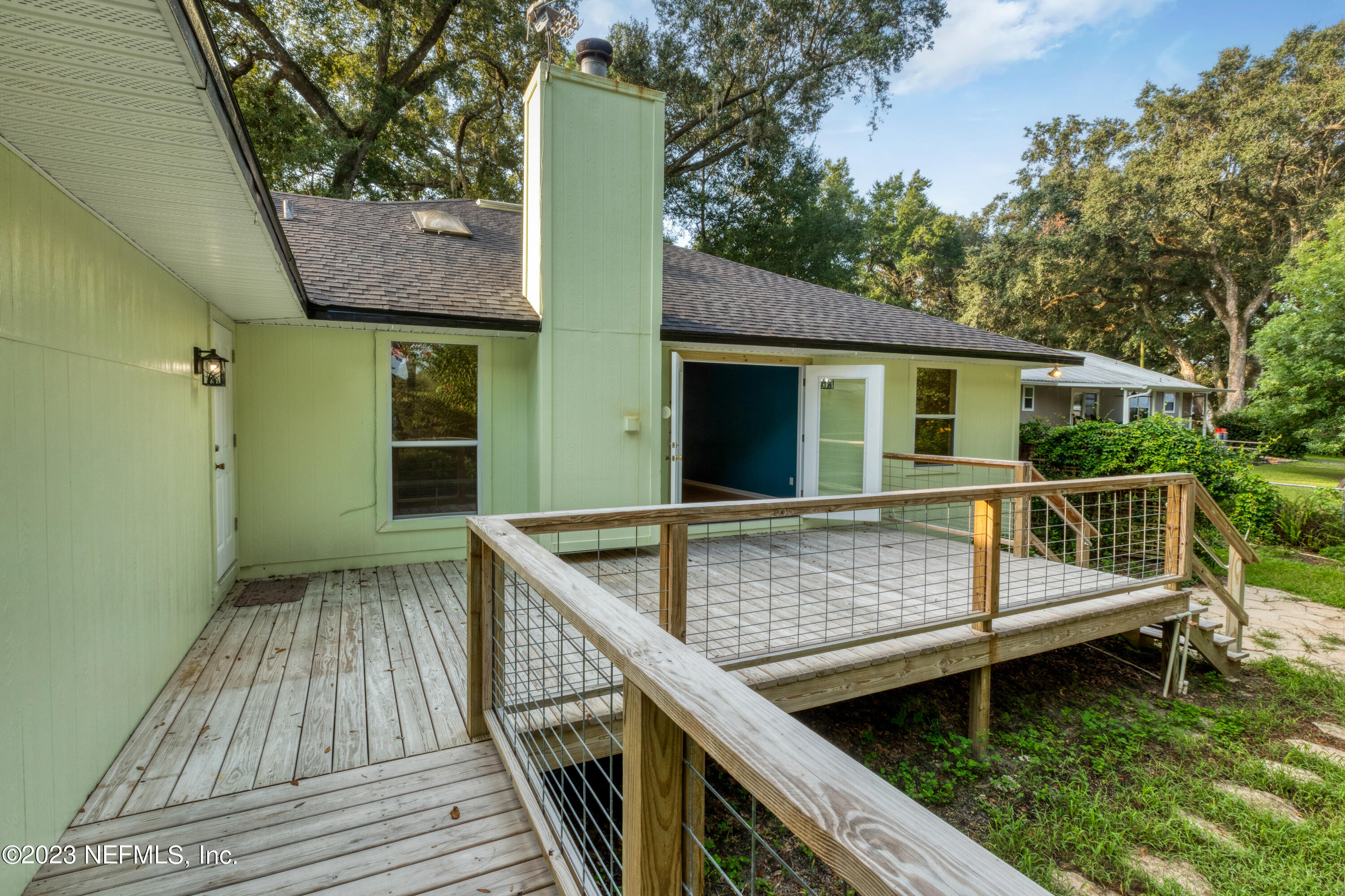 445 Southeast 28th Loop Melrose, FL 32666 - Photo 60 of 75 a view of house with outdoor seating area