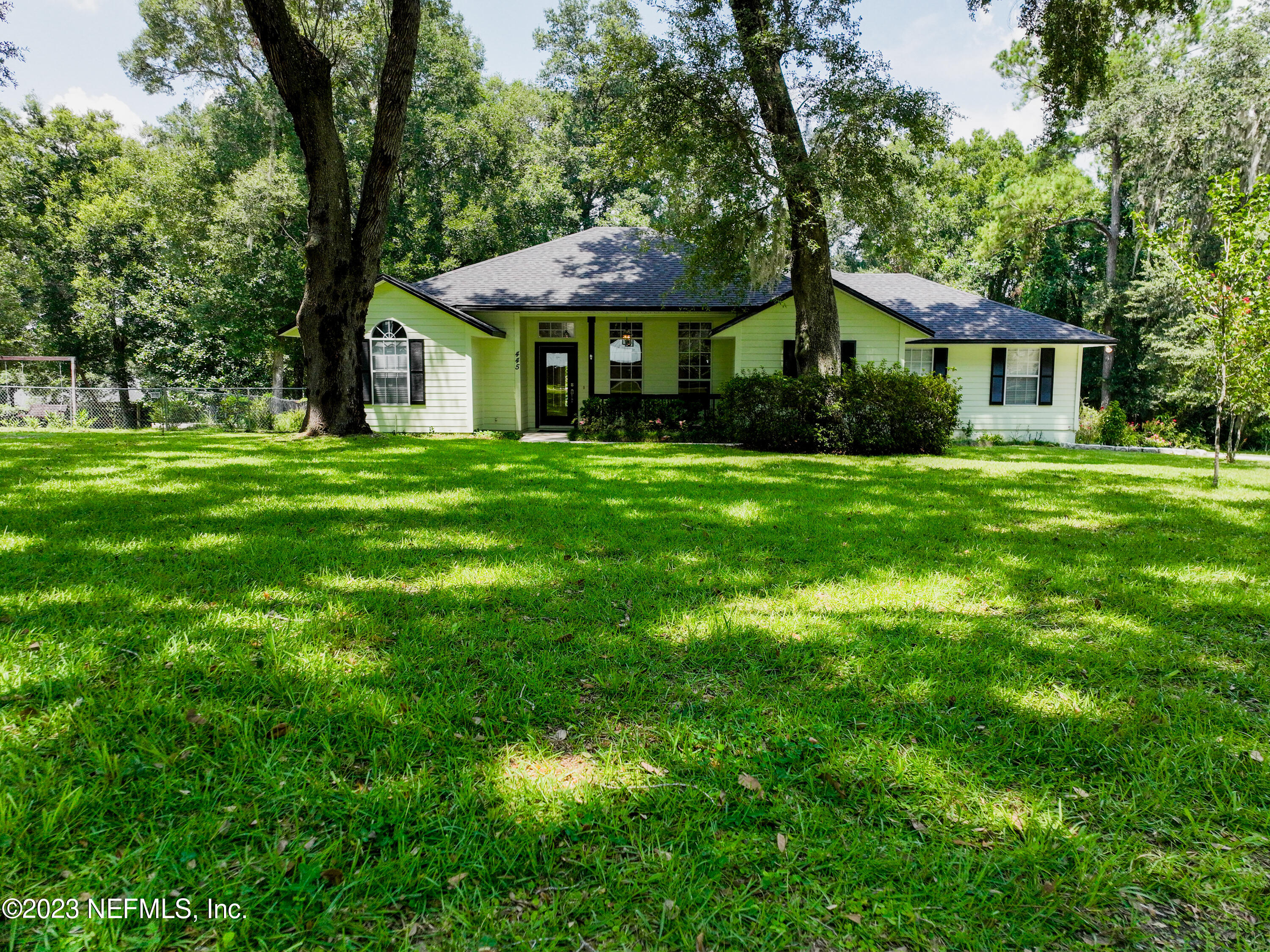 445 Southeast 28th Loop Melrose, FL 32666 - Photo 68 of 75 a front view of a house with a yard