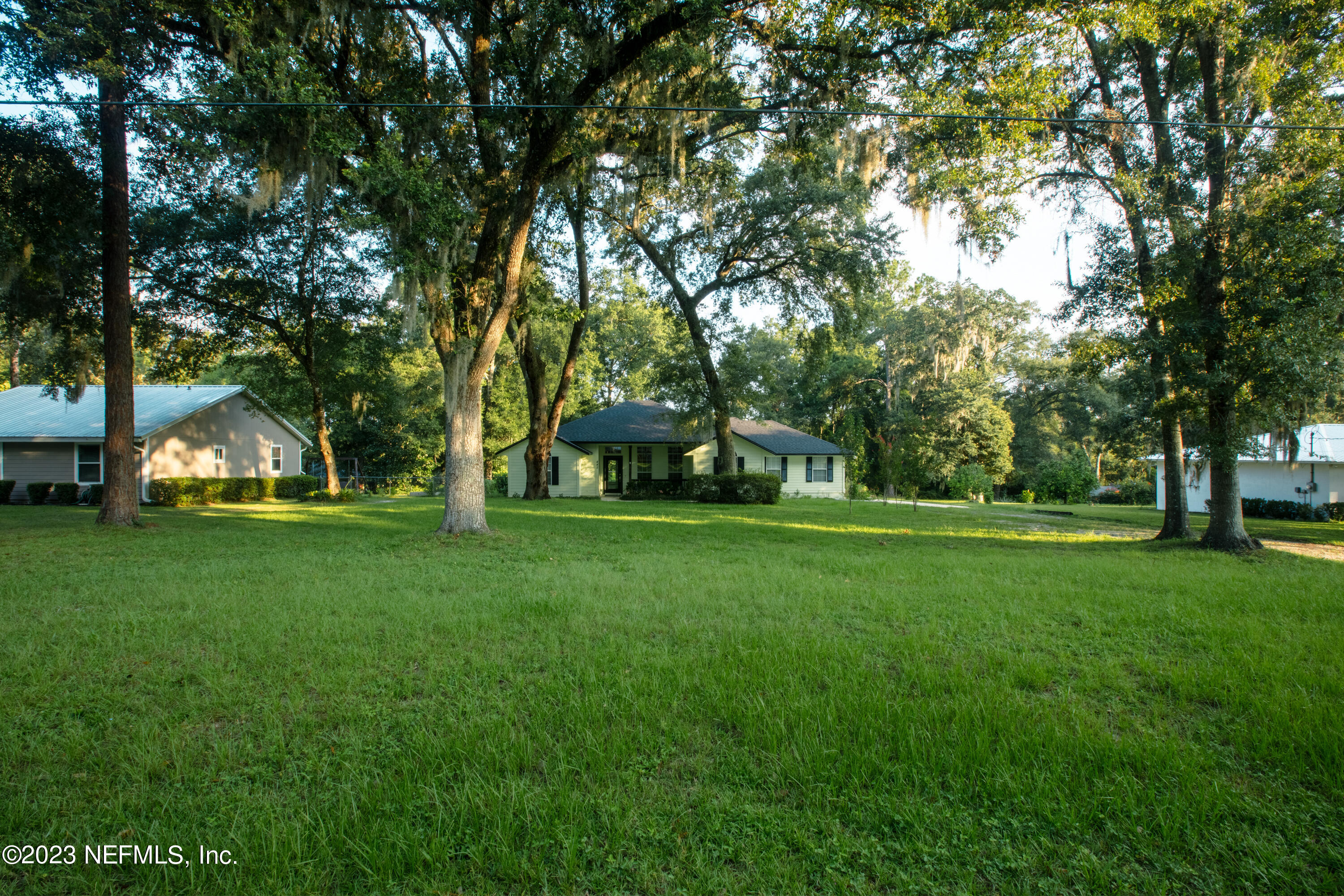445 Southeast 28th Loop Melrose, FL 32666 - Photo 7 of 75 a huge green field with lots of trees