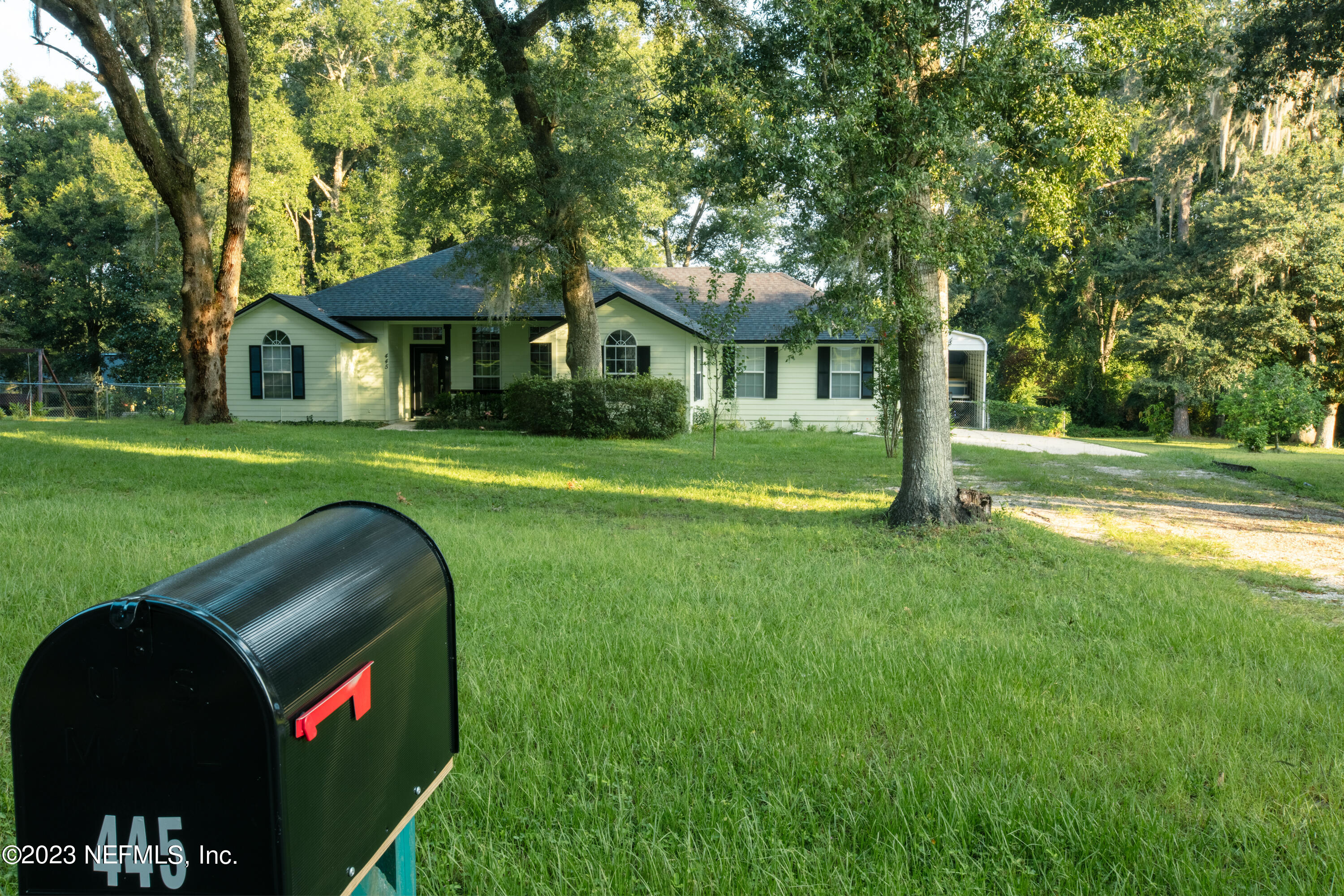445 Southeast 28th Loop Melrose, FL 32666 - Photo 8 of 75 a front view of a house with a yard