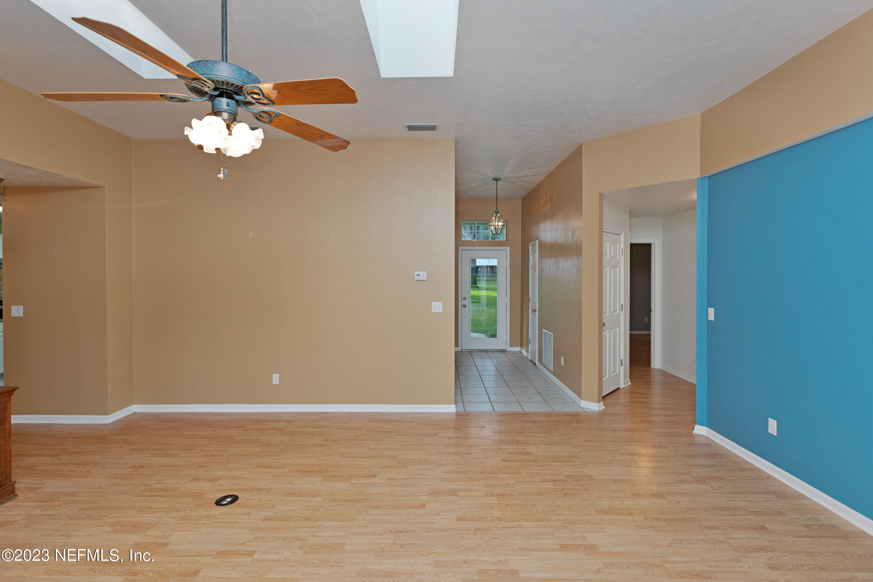 445 Southeast 28th Loop Melrose, FL 32666 - Photo 10 of 75 a view of a livingroom with a ceiling fan and wooden floor