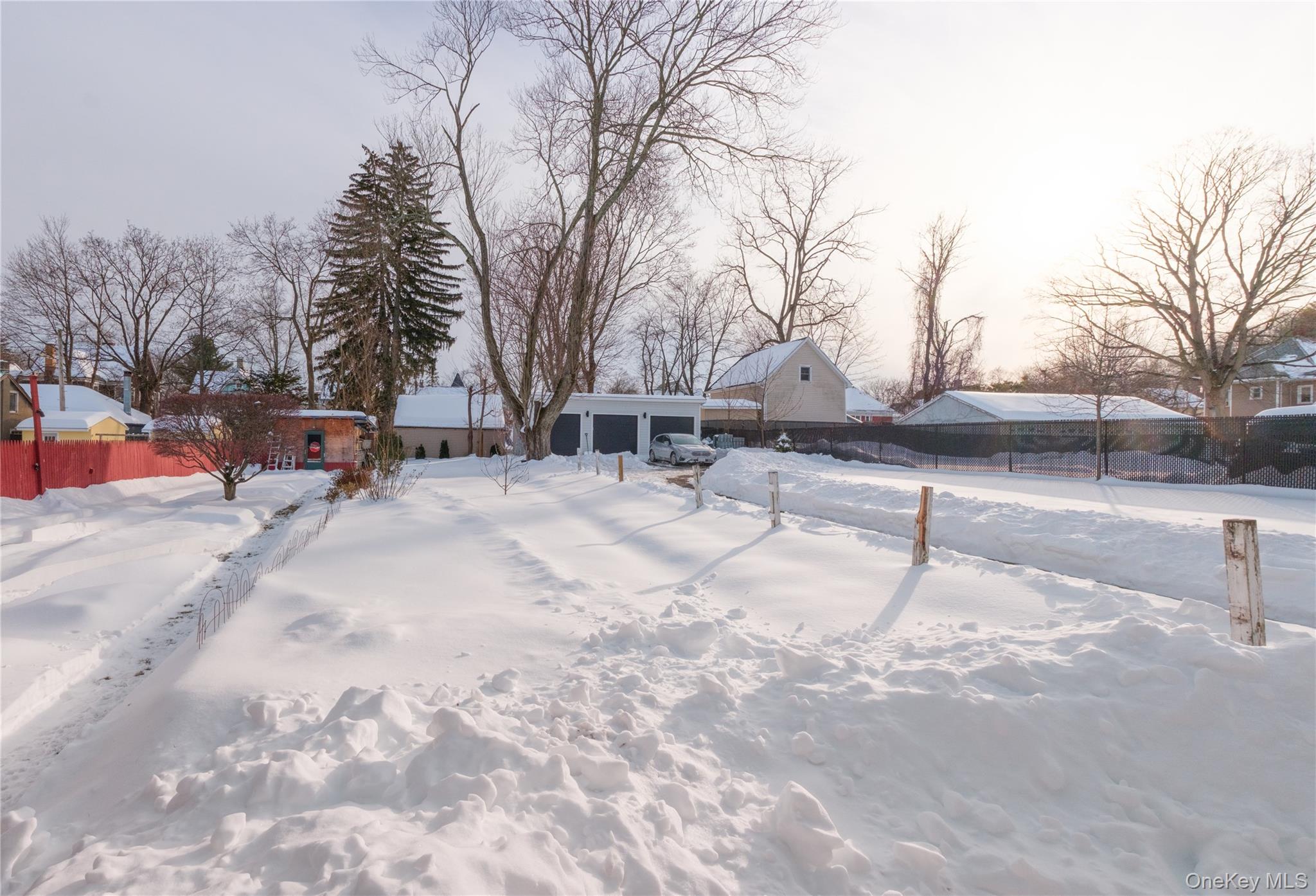 925 Constant Avenue Peekskill, NY 10566 - Photo 26 of 28 Yard layered in snow with an outbuilding and a residential view