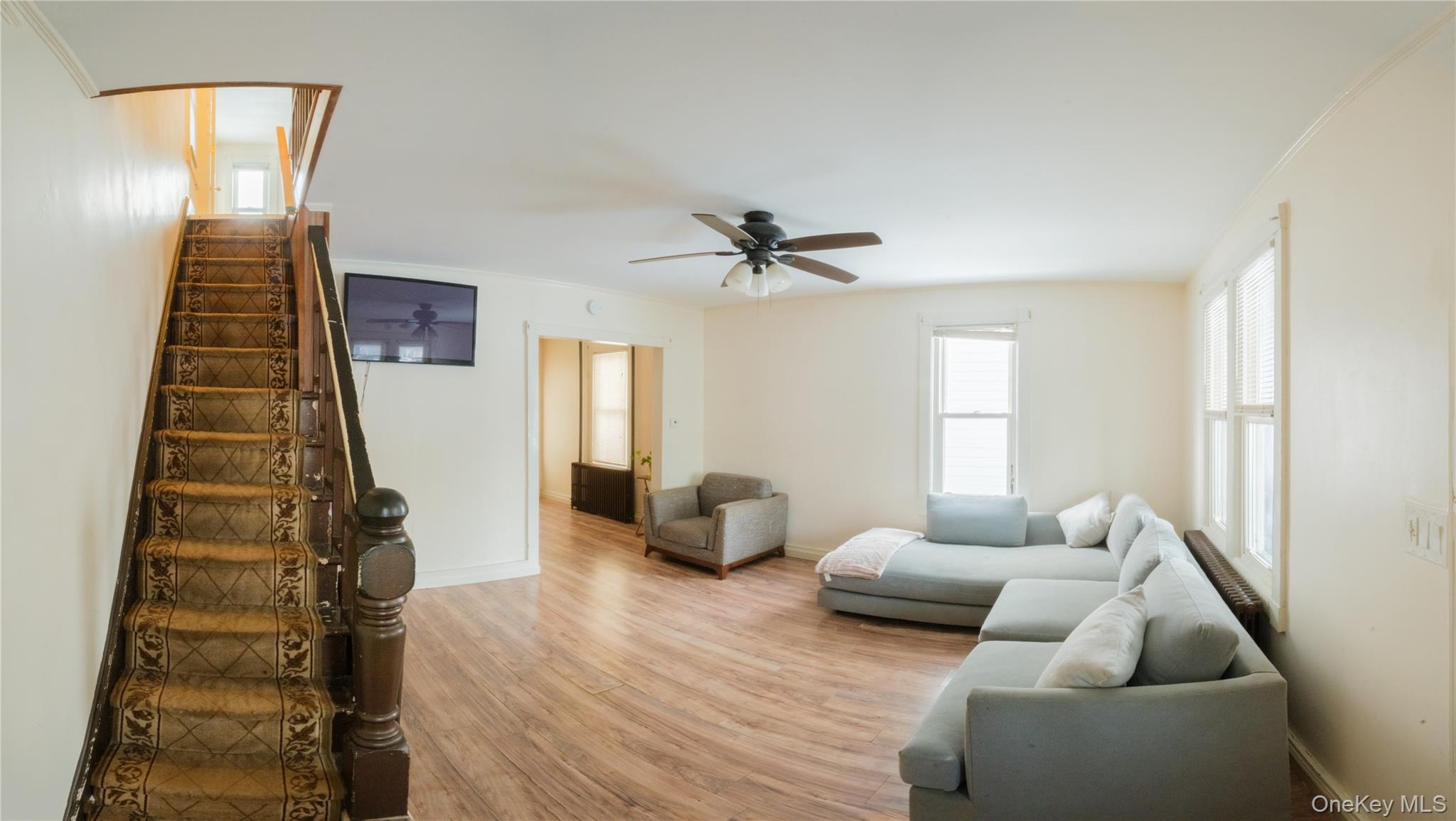 925 Constant Avenue Peekskill, NY 10566 - Photo 6 of 28 Living room with wood finished floors and a ceiling fan