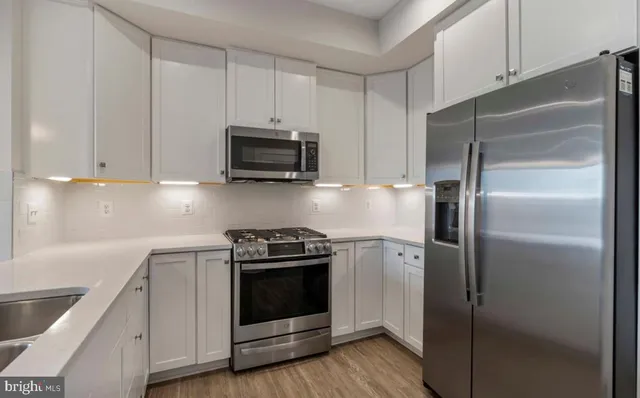 a kitchen with a stove microwave and refrigerator