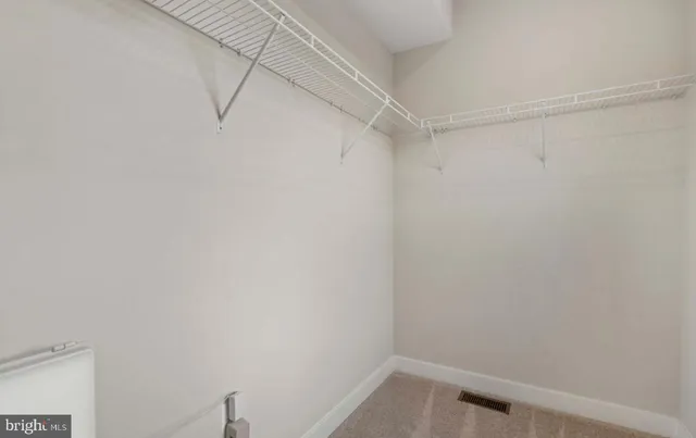 a view of a room with racks on the wall