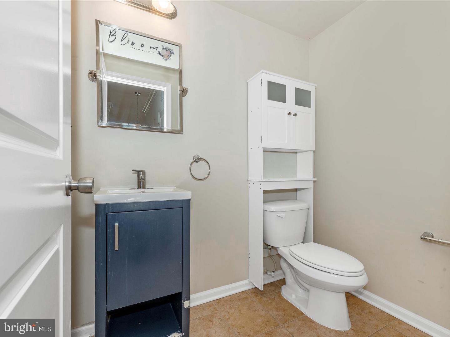 208 B Mill Pond Road Frederick, MD 21701 - Photo 21 of 45 a bathroom with a toilet sink and mirror