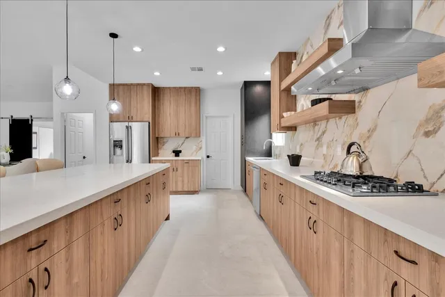 a spacious bedroom with a bed and large window