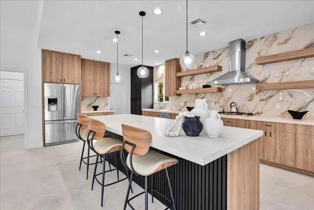 a bathroom with a double vanity sink and a bathtub