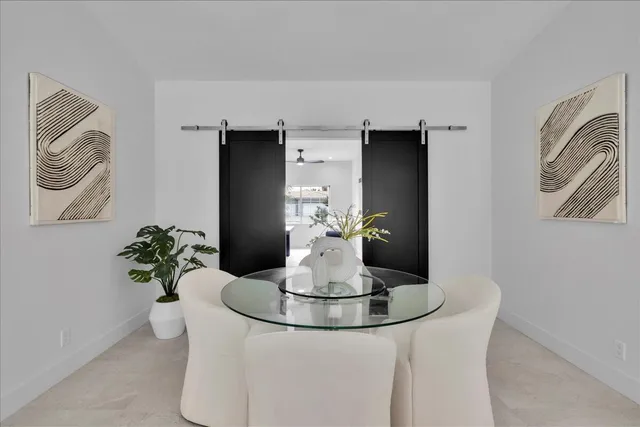 a white bath tub sitting in a bathroom next to a sink