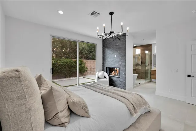 a view of a backyard with table and chairs