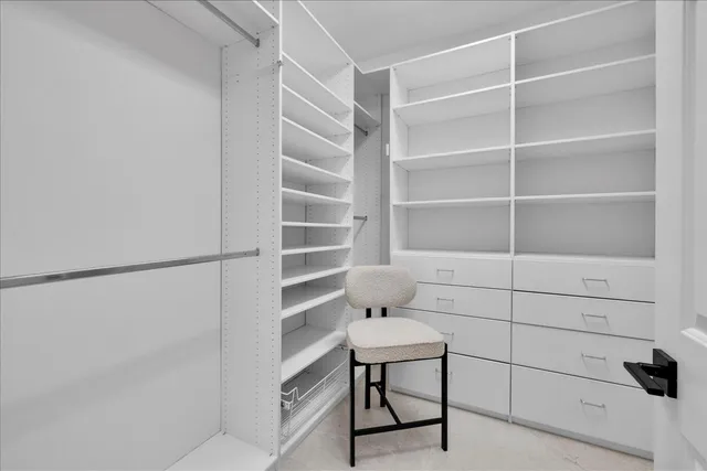 an aerial view of residential houses with outdoor space and parking