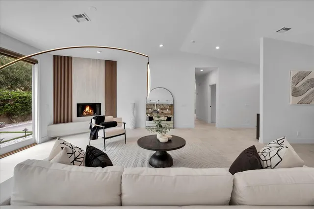 a large kitchen with stainless steel appliances kitchen island a large counter space a sink and cabinets