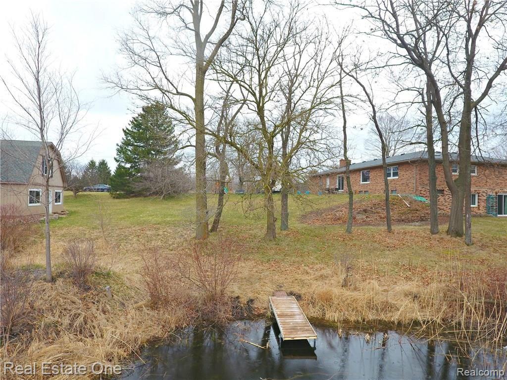 2822 Lone Tree Road Highland, MI 48357 - Photo 5 of 33 Dock to water great for fishing or launching the kayak.