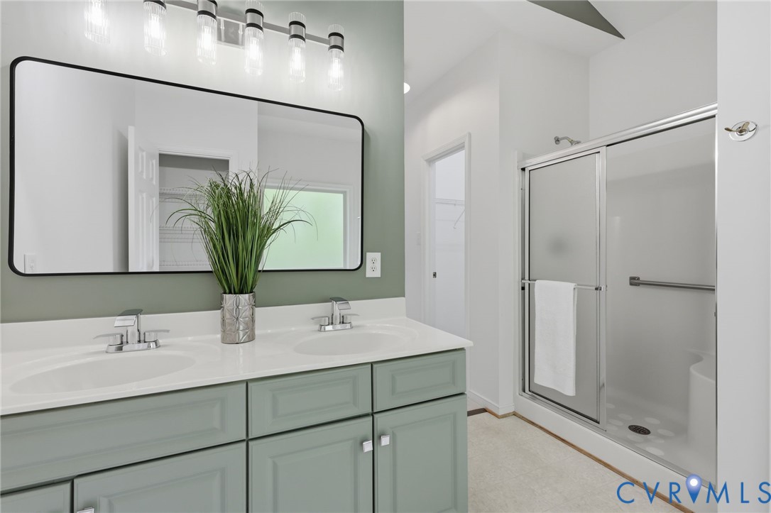 1700 Rolfield Way Henrico, VA 23238 - Photo 23 of 44 a bathroom with a double vanity sink mirror and shower