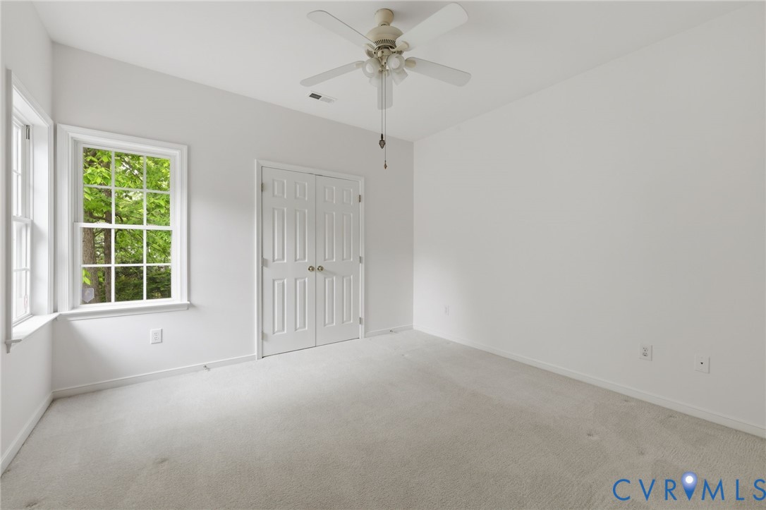 1700 Rolfield Way Henrico, VA 23238 - Photo 25 of 44 an empty room with windows and fan