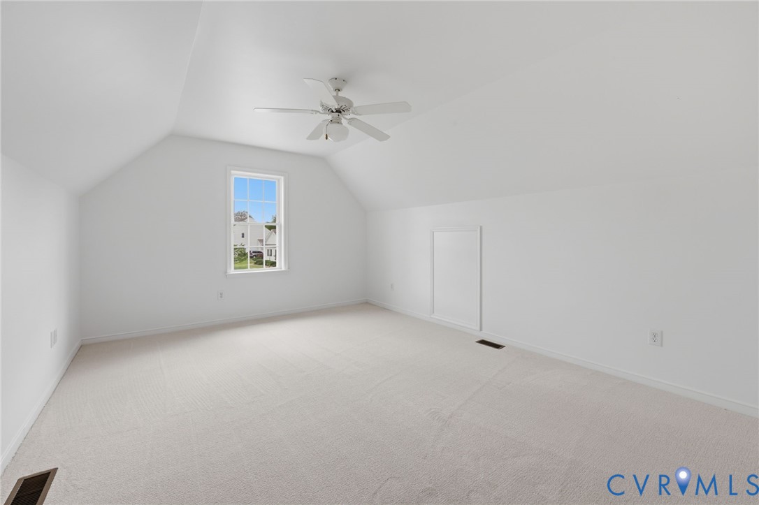 1700 Rolfield Way Henrico, VA 23238 - Photo 33 of 44 an empty room with a ceiling fan and windows