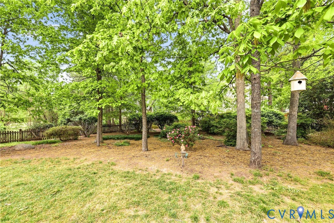 1700 Rolfield Way Henrico, VA 23238 - Photo 38 of 44 a backyard of a house with table and chairs