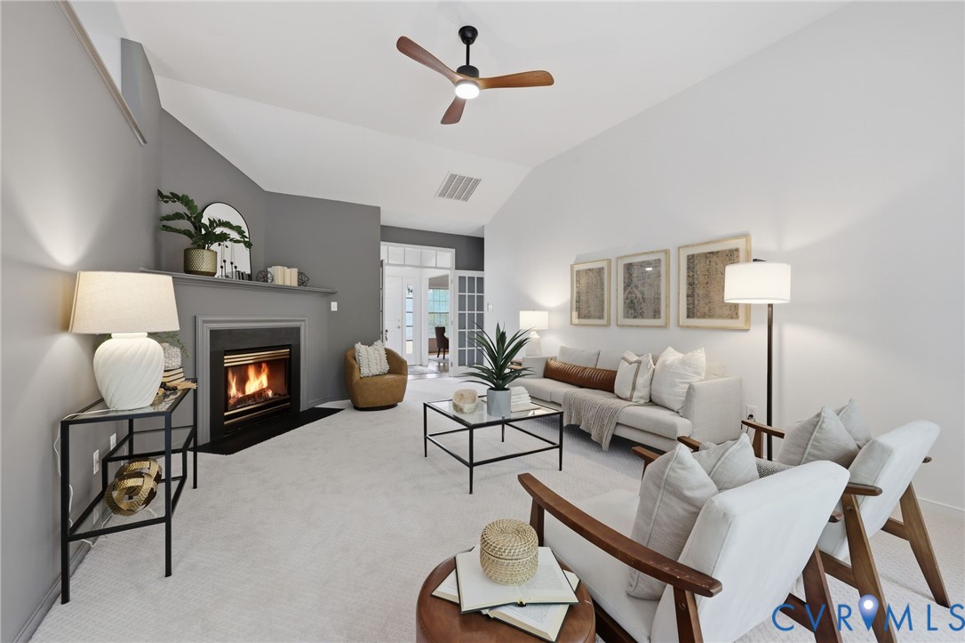 1700 Rolfield Way Henrico, VA 23238 - Photo 8 of 44 a living room with furniture a fireplace and a table