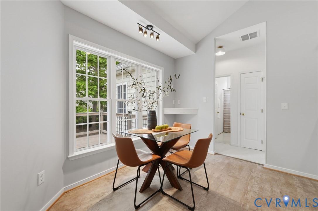 1700 Rolfield Way Henrico, VA 23238 - Photo 10 of 44 a view of a dining room with furniture and a window