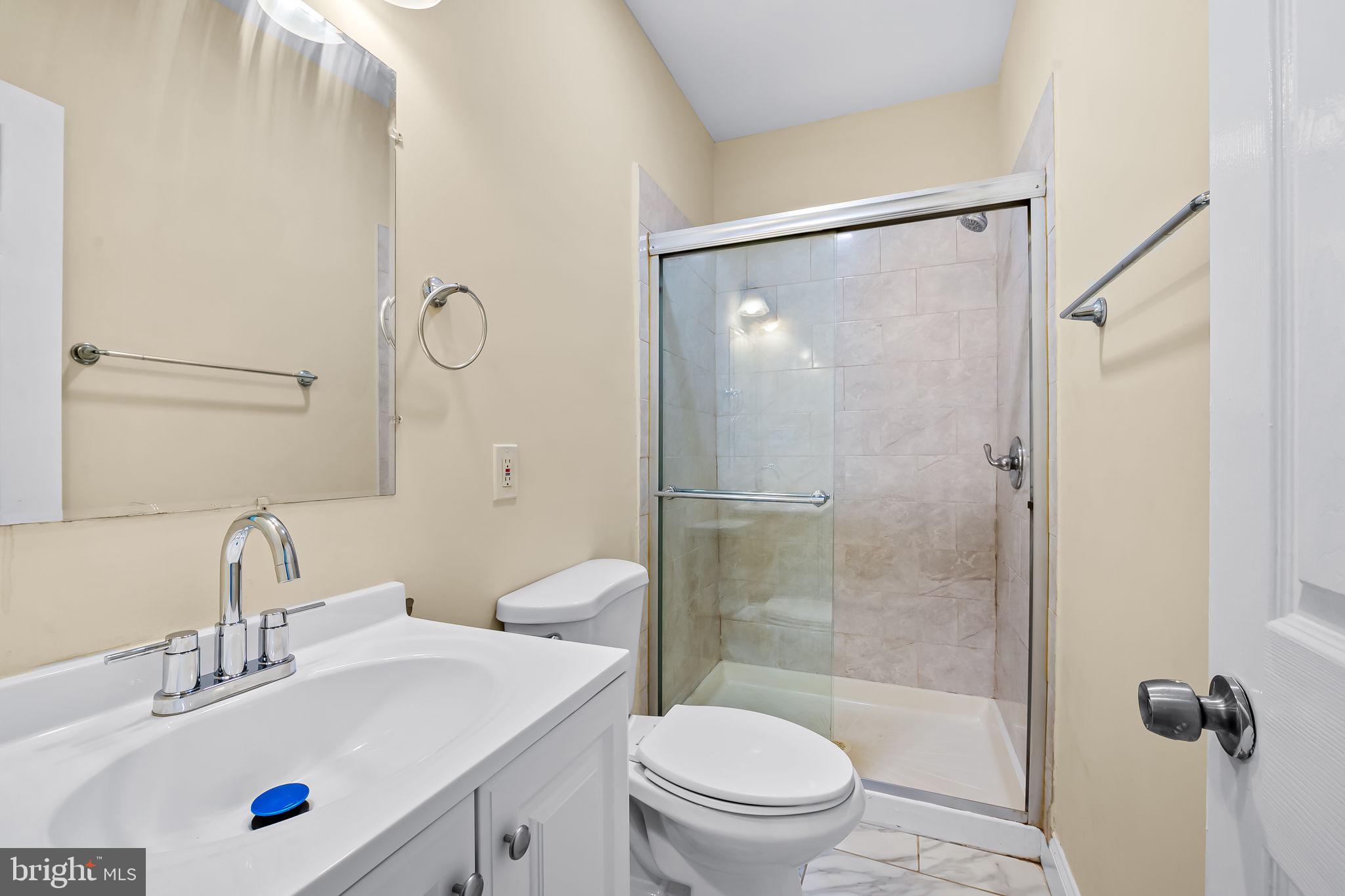 307 Fagley Street Baltimore, MD 21224 - Photo 18 of 24 a bathroom with a sink toilet and shower