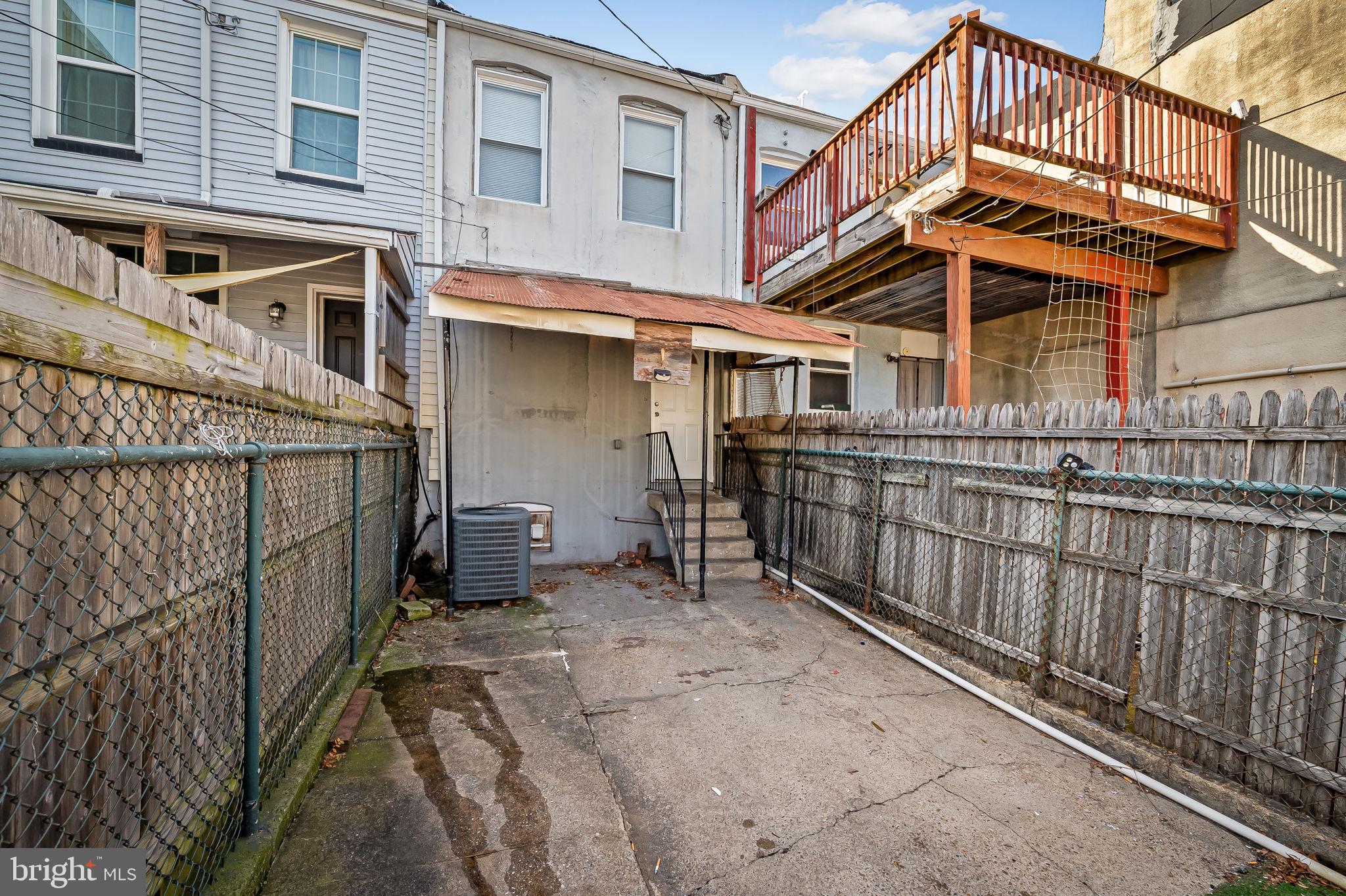 307 Fagley Street Baltimore, MD 21224 - Photo 23 of 24 a view of a house with wooden fence