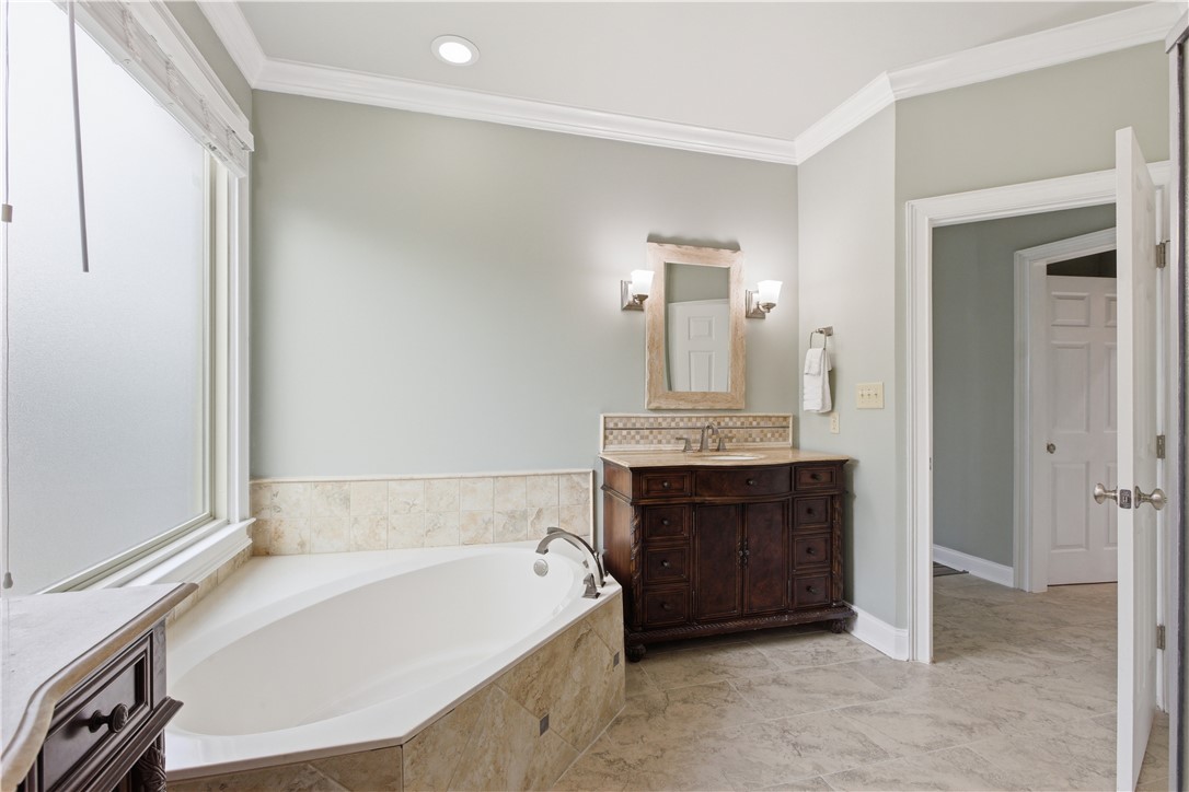 501 Capri Point Lavonia, GA 30553 - Photo 29 of 50 This serene bathroom offers a soaking tub and a spacious vanity for ultimate relaxation.